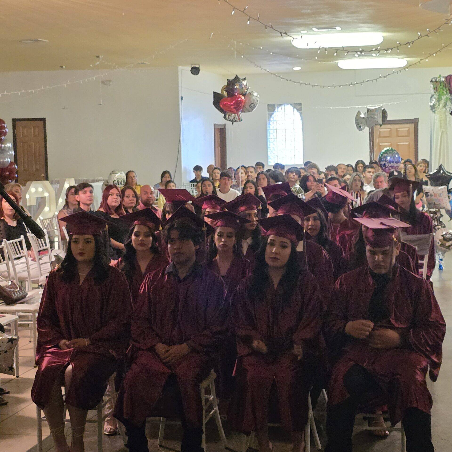 Dr. Emma giving a speech at the PPE graduation ceremony.