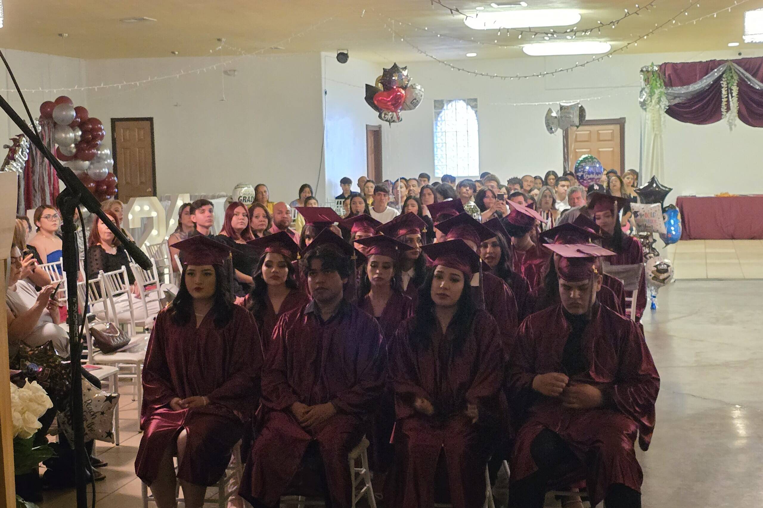 Dr. Emma giving a speech at the PPE graduation ceremony.