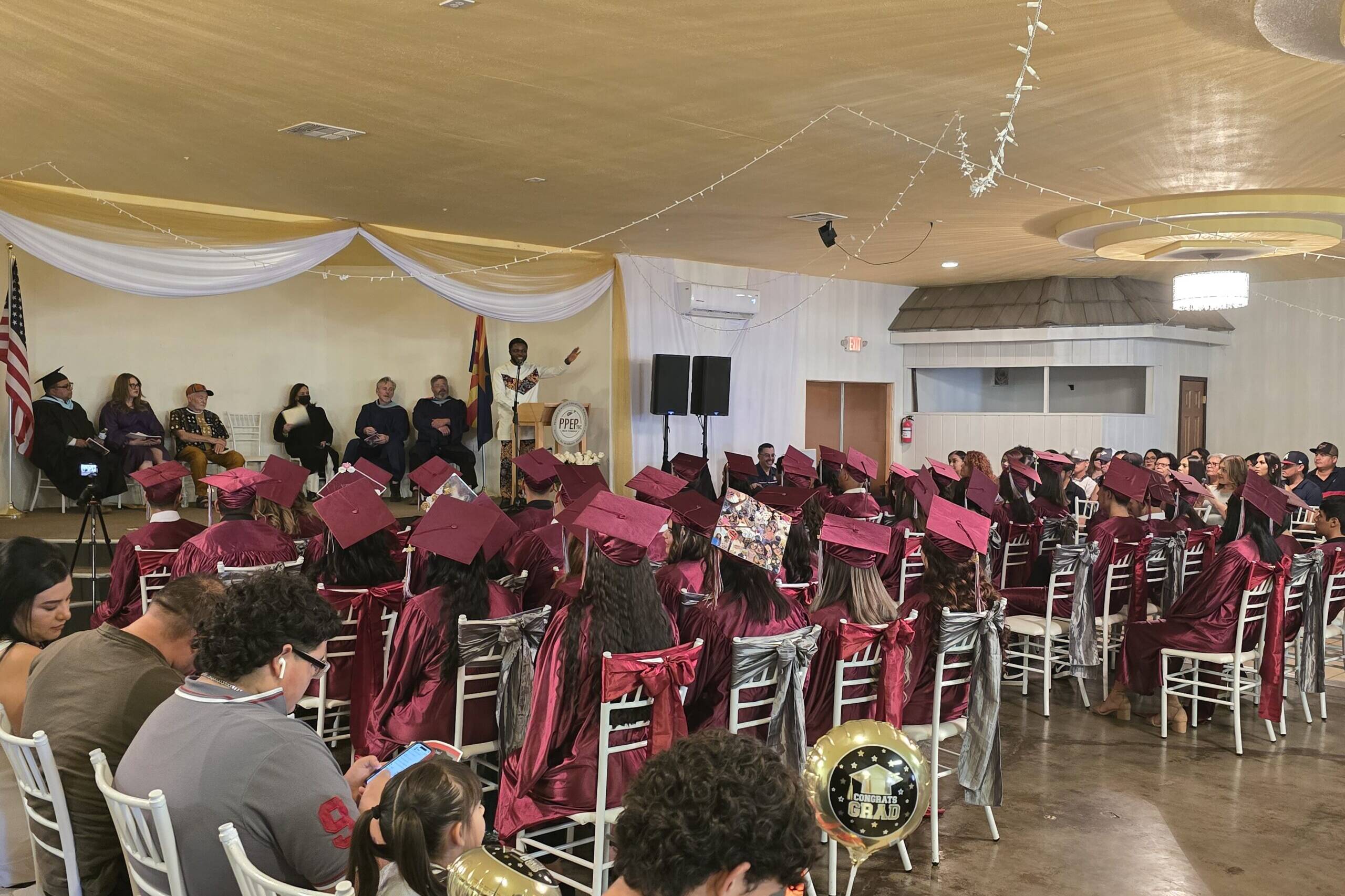 Dr. Emma giving a speech at the PPE graduation ceremony.